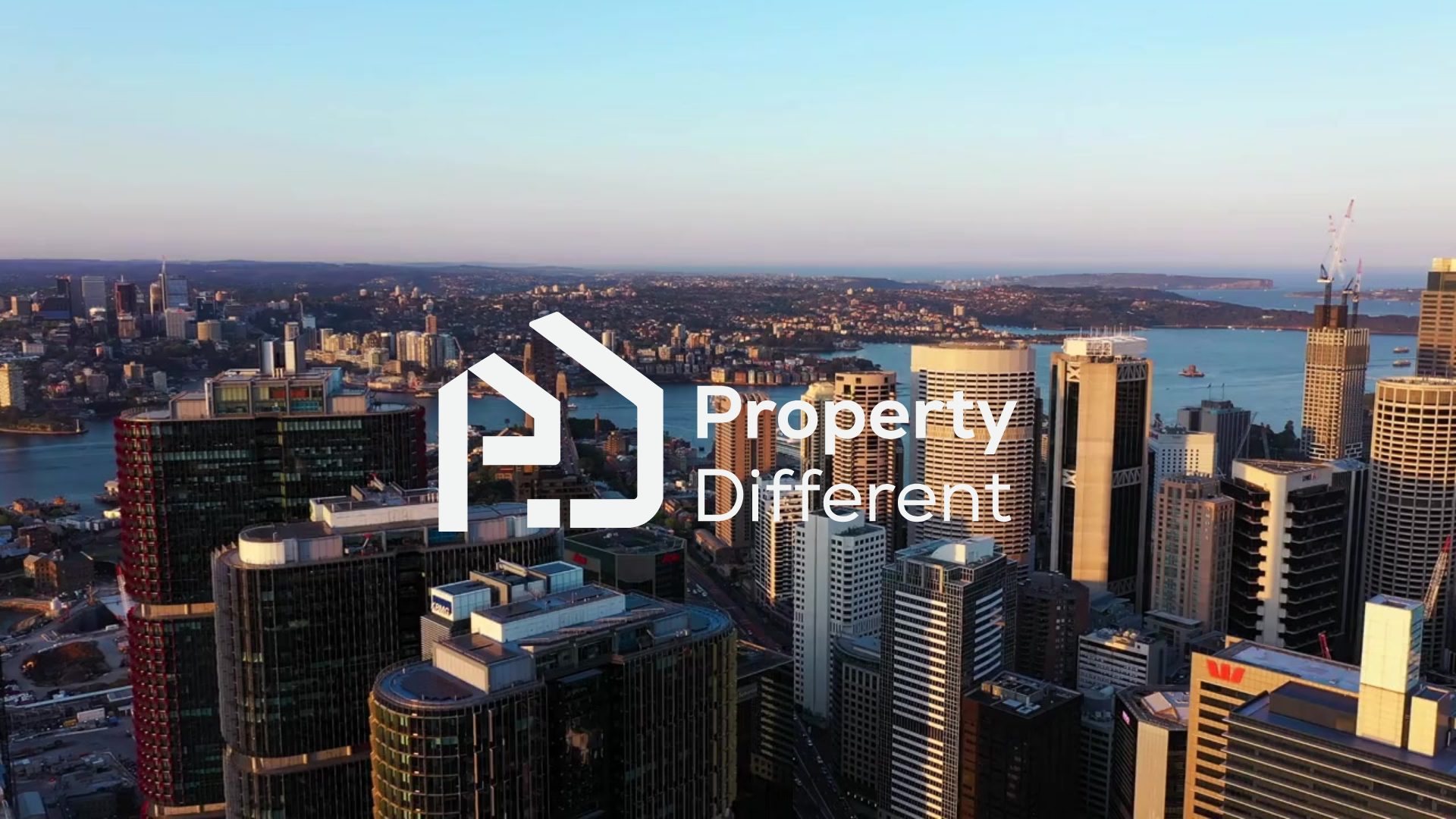 Aerial view of the Sydney CBD with the Property Different logo